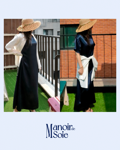 Versatile Midnight Navy mulberry silk dress (short-sleeved) styled on a woman in two ways: layered with a white shirt for a refined look, and with the white shirt tied at the waist for a relaxed, everyday elegance. Showcases comfortable flow, perfect for summer outfits or vacation wear. Features "Manoir de Soie" brand.