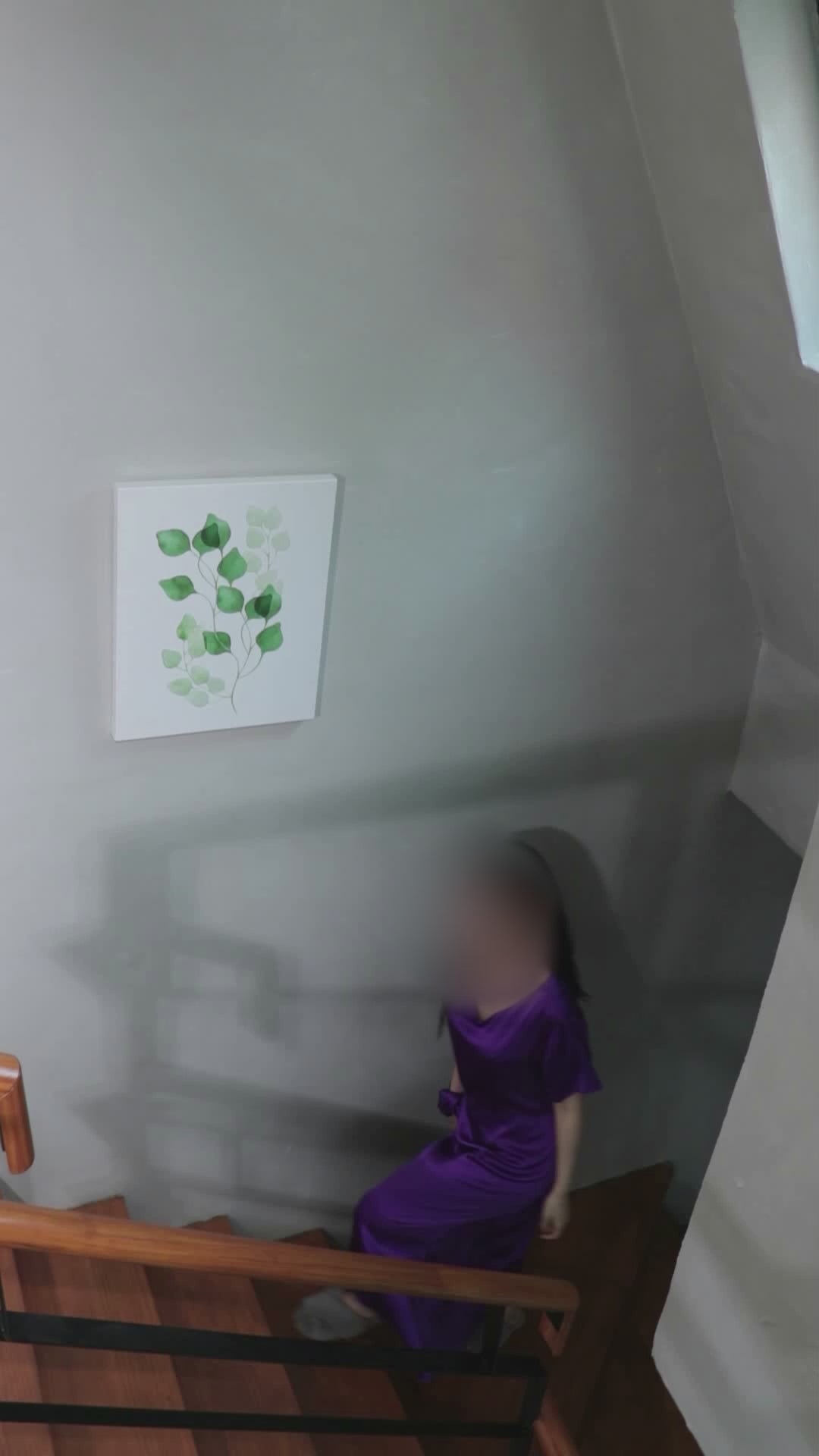 Video demonstrating the Royal Purple mulberry silk maxi dress in motion, as a woman ascends and descends stairs. The video captures the dress from various angles and movements, showcasing its elegant drape, fluidity, and comfortable fit during real-life activity, emphasizing its suitability for everyday wear.